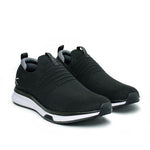 Pair of KURU ATOM Slip-On Men's Slip-On Sneaker in Jet Black-Slate Gray, angled view.