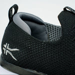 Close-up of the upper material on the KURU ATOM Slip-On Men's Slip-On Sneaker in Jet Black-Slate Gray.