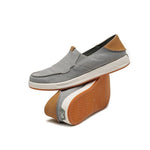 Pair of KURU PACE Men's Slip-On Sneaker in Lead Gray-Cedar Brown, angled view.