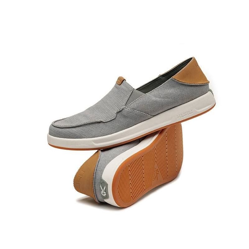 Pair of KURU PACE Men's Slip-On Sneaker in Lead Gray-Cedar Brown, angled view.