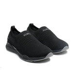 Pair of KURU STRIDE Women's Slip-On Sneaker in Jet Black-Slate Gray, angled view.