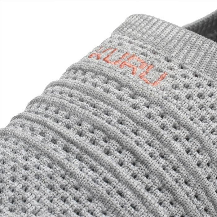 Close-up of the upper material on the KURU STRIDE WIDE Women's Slip-On Sneaker in Heather Gray-White-Peach Pink.