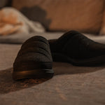 Angled profile view of the KURU DRAFT 2 Men's Slipper in Jet Black.