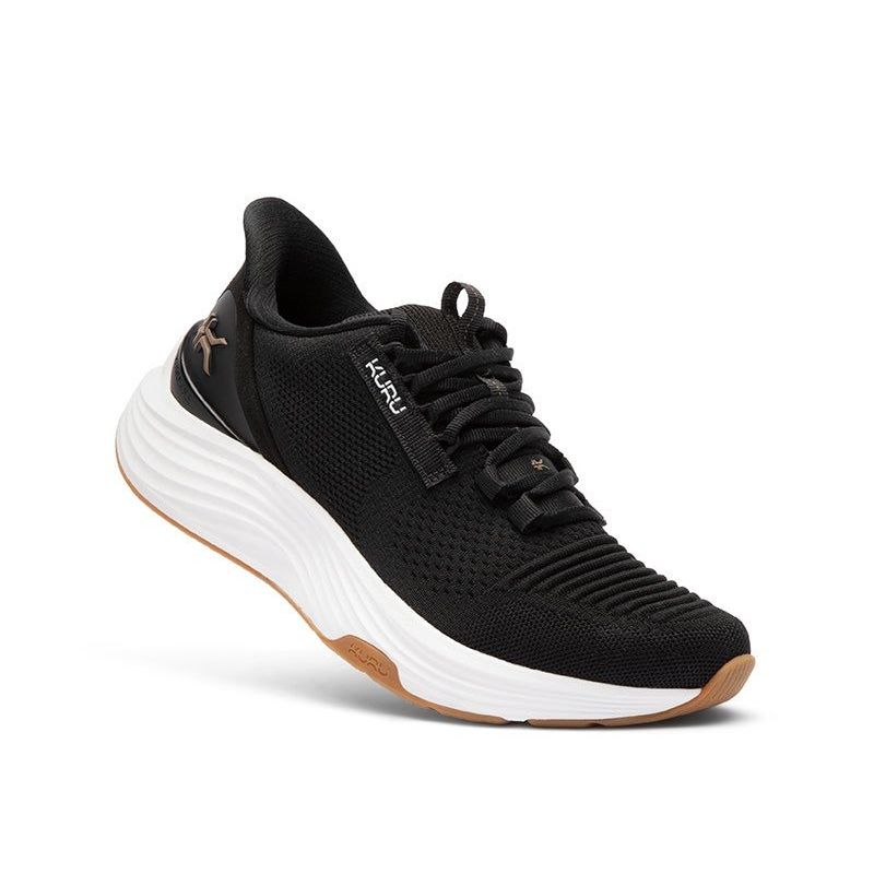 Angled profile view of the KURU ATOM 2 Women's Sneaker in Jet Black-Desert Tan.