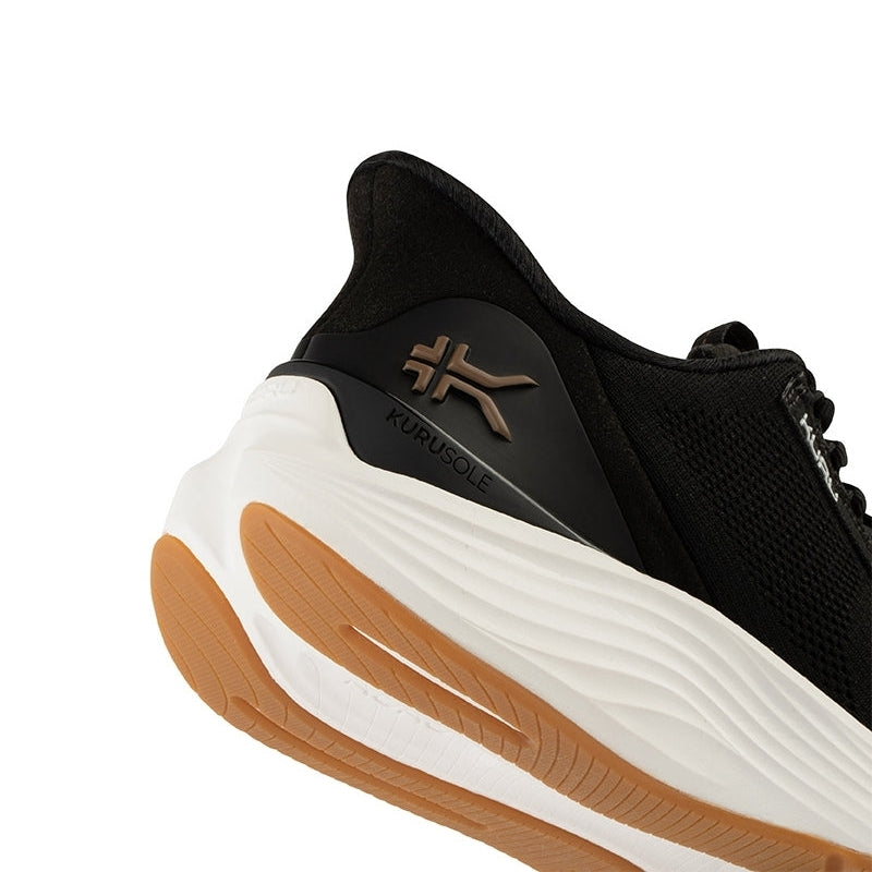 Close-up of the upper material on the KURU ATOM 2 Women's Sneaker in Jet Black-Desert Tan.