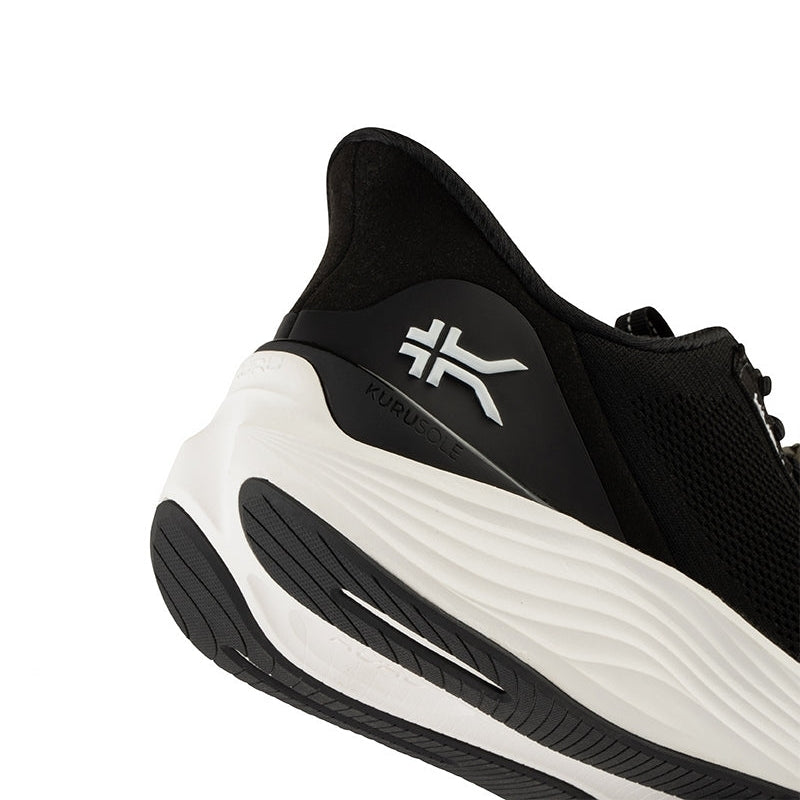 Close-up of the upper material on the KURU ATOM 2 WIDE Men's Sneaker in Jet Black-Bright White.