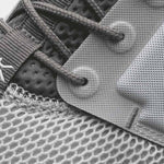 Pair of KURU ATOM Women's Sneaker in Cloud Gray-White-Iron Gray, angled view.