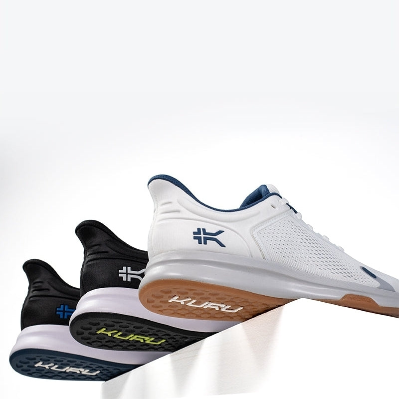 Angled profile view of the KURU ATOM Fusion Men's Sneaker in Jet Black-Bright White.