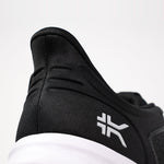 Outsole view of the KURU ATOM Fusion Men's Sneaker in Jet Black-Bright White, showing the KURUSOLE tread.