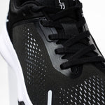Pair of KURU ATOM Fusion Women's Sneaker in Jet Black-Bright White, angled view.