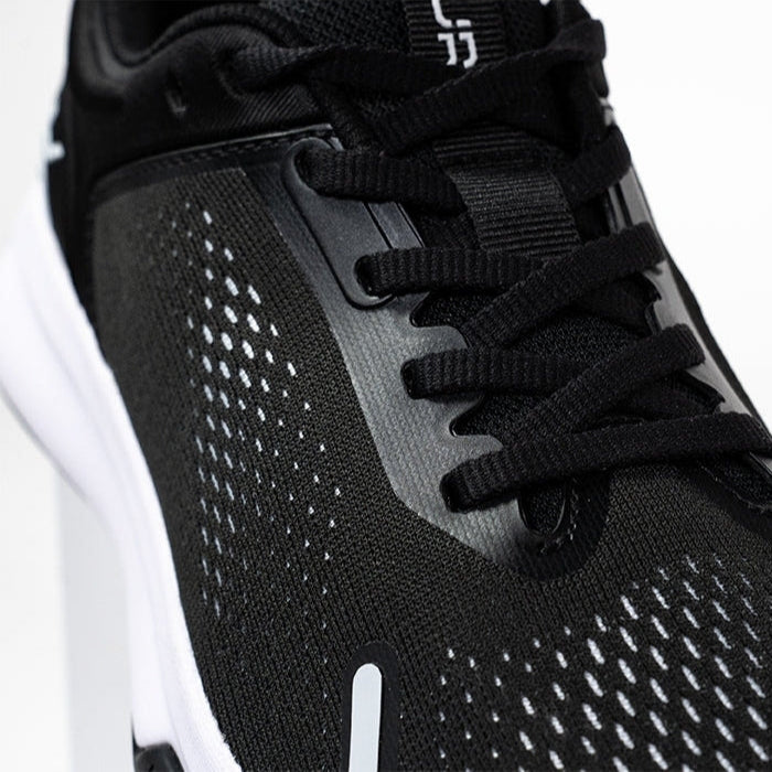Pair of KURU ATOM Fusion Women's Sneaker in Jet Black-Bright White, angled view.
