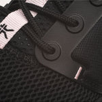 Pair of KURU ATOM Women's Sneaker in Jet Black-Misty Lilac, angled view.