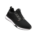 Angled profile view of the KURU ATOM Men's Sneaker in Jet Black-White-Fire Red.