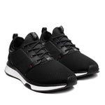 Pair of KURU ATOM Men's Sneaker in Jet Black-White-Fire Red, angled view.