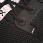 Pair of KURU ATOM WIDE Women's Sneaker in Jet Black-Misty Lilac, angled view.