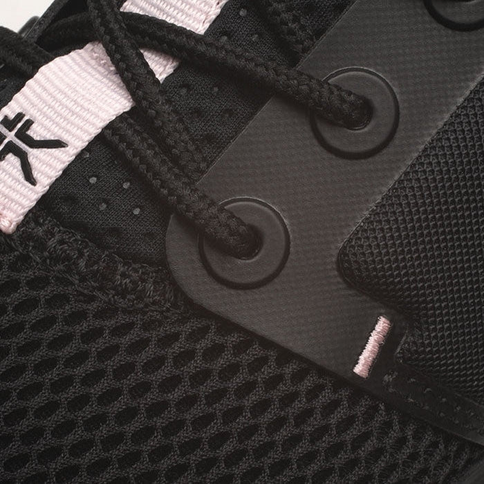 Pair of KURU ATOM WIDE Women's Sneaker in Jet Black-Misty Lilac, angled view.