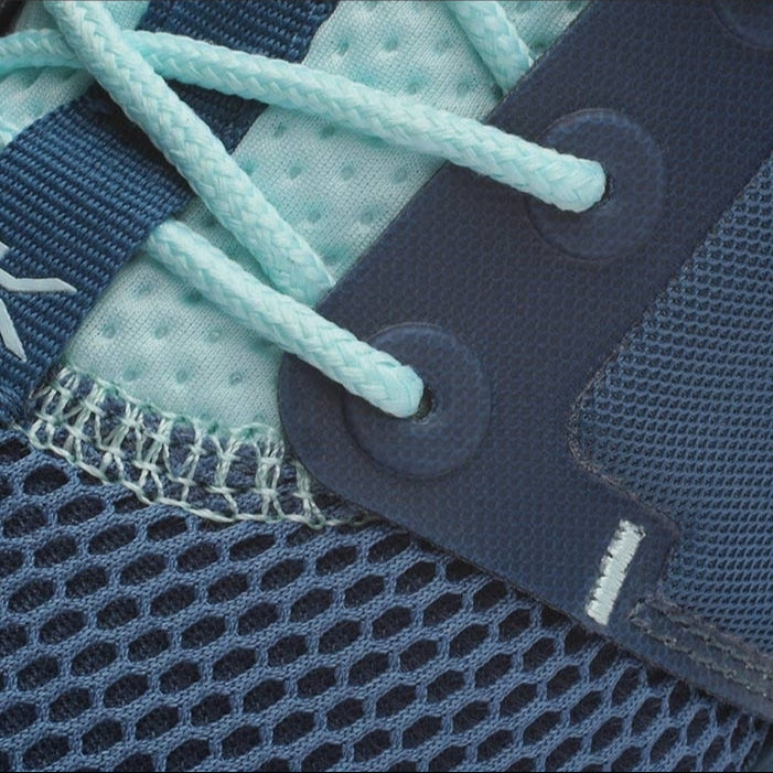 Pair of KURU ATOM WIDE Women's Sneaker in Tidal Wave-White-Oasis Blue, angled view.