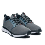 Angled profile view of the KURU ATOM Waterproof Men's Sneaker in Blue Haze-Charcoal Gray.