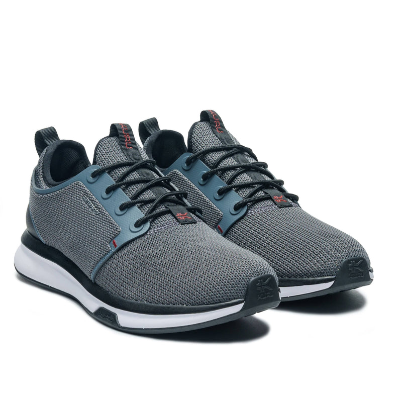 Angled profile view of the KURU ATOM Waterproof Men's Sneaker in Blue Haze-Charcoal Gray.