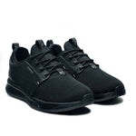 Angled profile view of the KURU ATOM Waterproof Men's Sneaker in Jet Black.