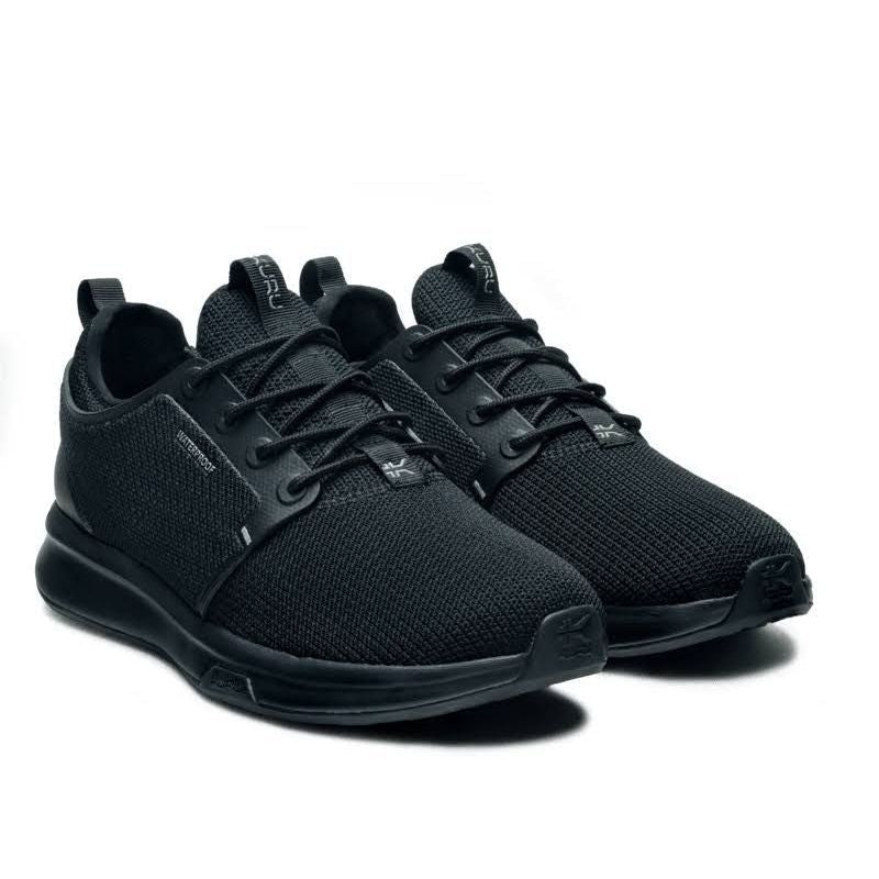 Angled profile view of the KURU ATOM Waterproof Men's Sneaker in Jet Black.