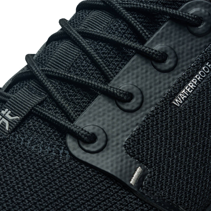 Pair of KURU ATOM Waterproof Men's Sneaker in Jet Black, angled view.