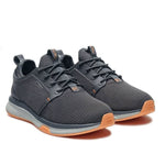 Angled profile view of the KURU ATOM Waterproof Women's Sneaker in Smoke Gray-Apricot.
