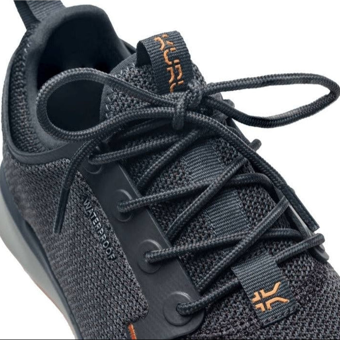 Close-up of the upper material on the KURU ATOM Waterproof Women's Sneaker in Smoke Gray-Apricot.