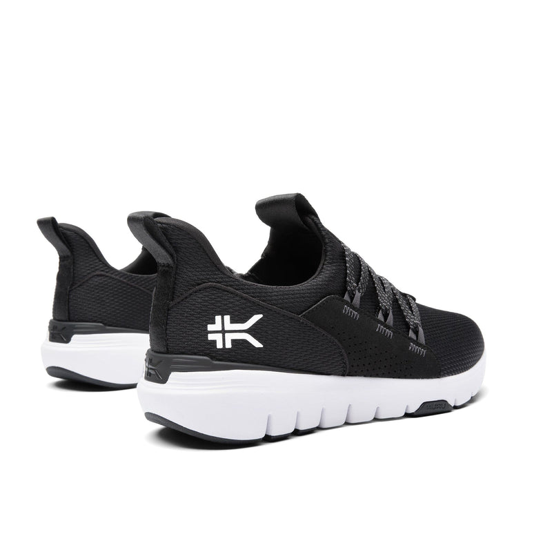 Pair of KURU FLEX Slip-On Men's Sneaker in Jet Black-Bright White, angled view.