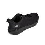 Angled profile view of the KURU FLEX Via Men's Sneaker in Jet Black.