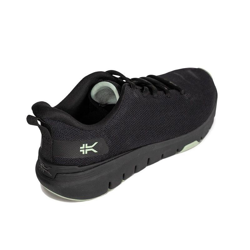 Angled profile view of the KURU FLEX Via Women's Sneaker in Jet Black-Desert Green.