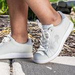 Person wearing the KURU ROAM Women's Sneaker.