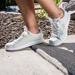 Person wearing the KURU ROAM Women's Sneaker.