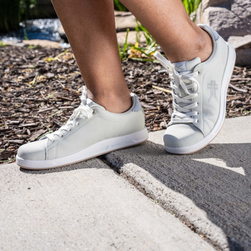 Person wearing the KURU ROAM Women's Sneaker.