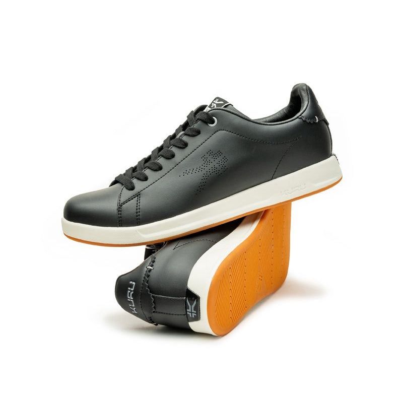 Pair of KURU ROAM Women's Sneaker in Jet Black-Bright White, angled view.