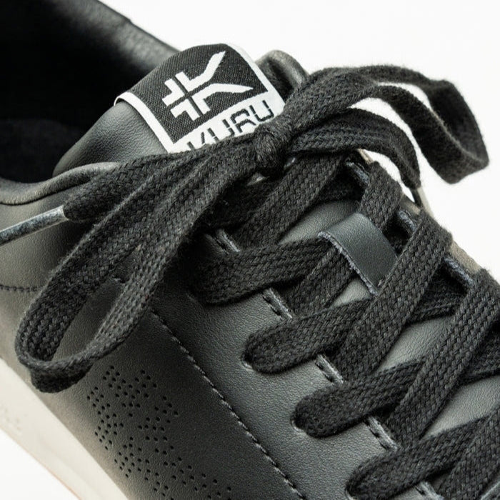 Close-up of the upper material on the KURU ROAM Women's Sneaker in Jet Black-Bright White.