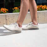 Pair of KURU ROAM Women's Sneaker in Sand-Pebble, angled view.