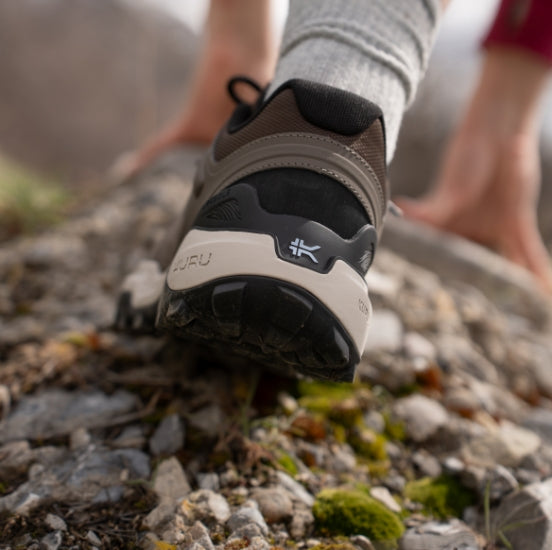 Person in motion wearing KURU RIDGE shoes, showcasing performance and movement for summer activities.