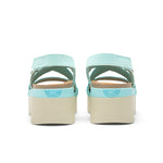 Back heel view of the KURU LOMA Women's Sandal in Aqua Spritzer.