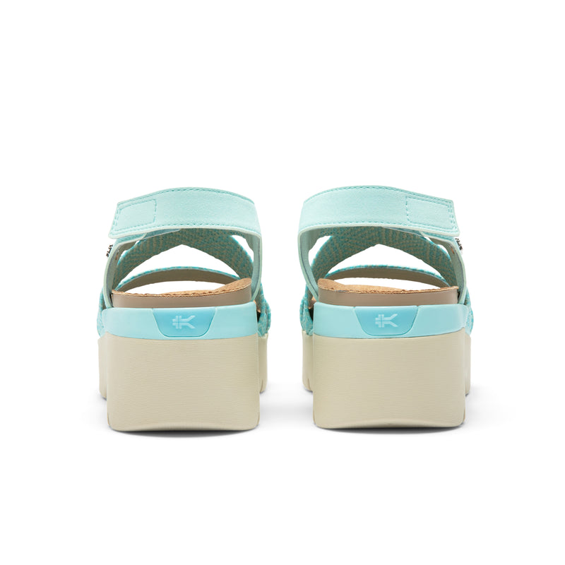 Back heel view of the KURU LOMA Women's Sandal in Aqua Spritzer.