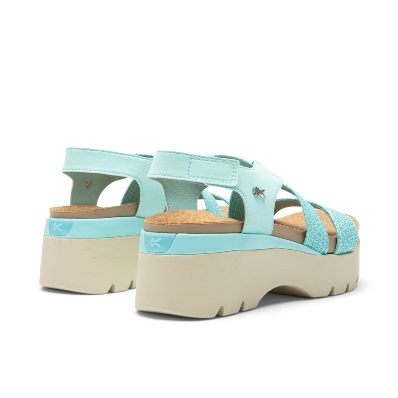 Close-up of the heel cup on the KURU LOMA Women's Sandal in Aqua Spritzer.