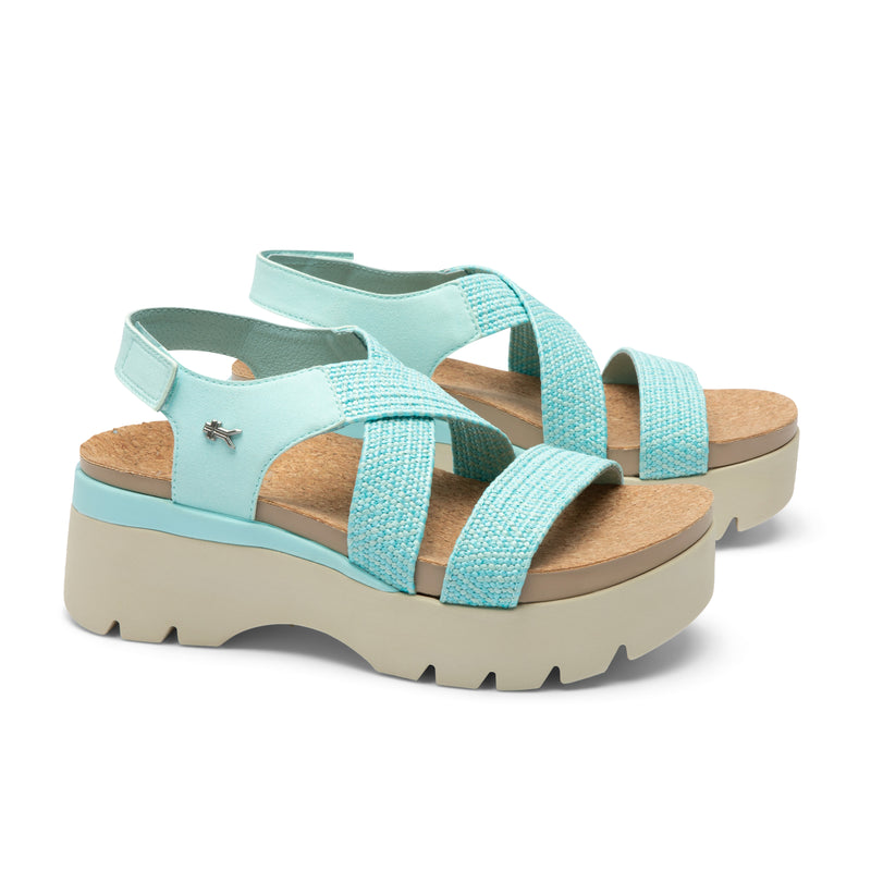 Pair of KURU LOMA Women's Sandal in Aqua Spritzer, angled view.