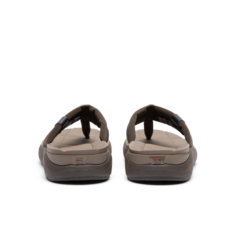 Back heel view of the KURU MOMENT Flip Men's Flip-Flop in Espresso Brown-Warmstone.