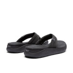 Close-up of the heel cup on the KURU MOMENT Flip Women's Flip-Flop in Jet Black.