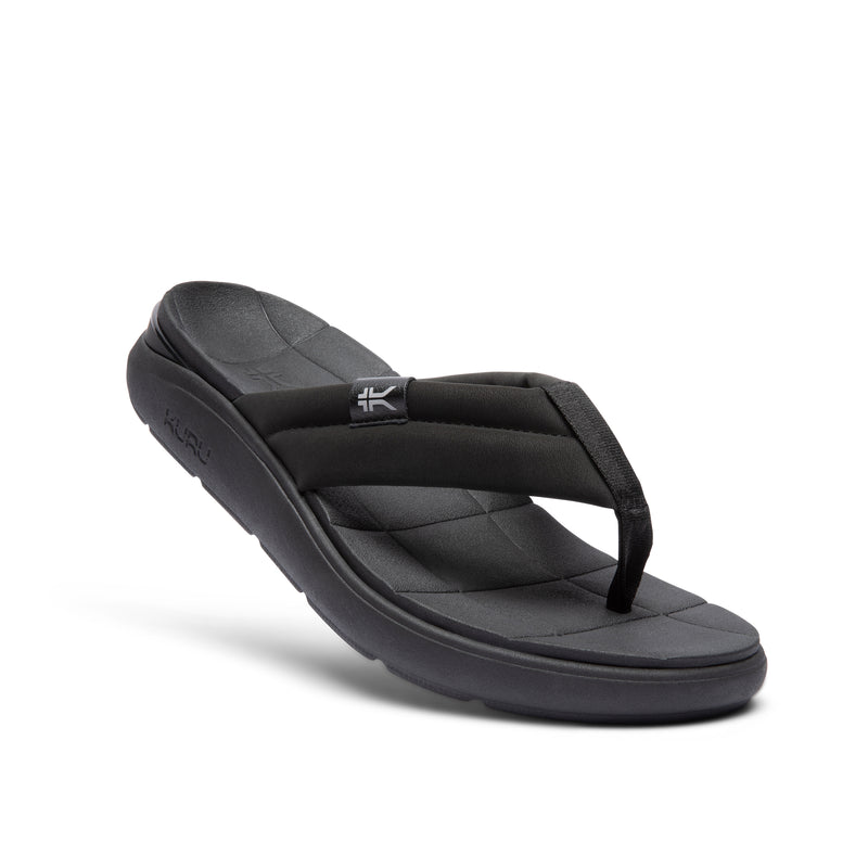 Angled profile view of the KURU MOMENT Flip Women's Flip-Flop in Jet Black.