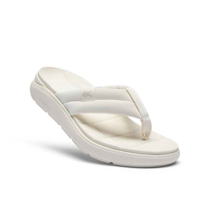 Angled profile view of the KURU MOMENT Flip Women's Flip-Flop in Ecru.