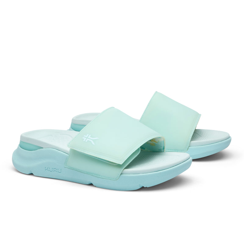 Pair of KURU MOMENT Women's Sandal in Aqua Frost, angled view.