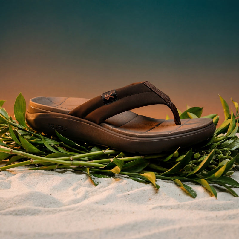 Angled profile view of the KURU MOMENT Flip Men's Flip-Flop in Espresso Brown-Warmstone.