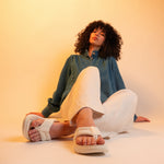 Pair of KURU MOMENT Flip Women's Flip-Flop in Ecru, angled view.