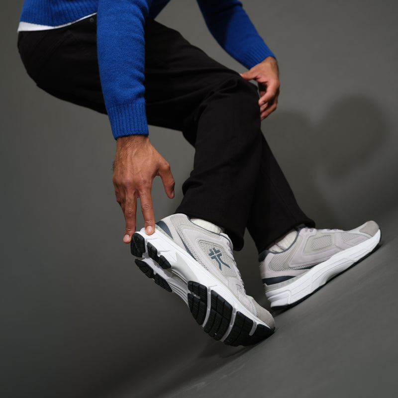 Person wearing the KURU SURGE Unisex Sneaker.